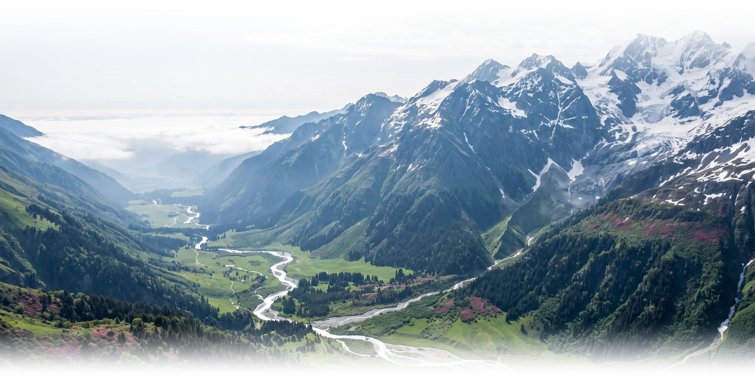 A high valley: a green cultivated floor and a braided river below dark conifer forest, a sea of cloud filling the far valley, and glaciated snow peaks enclosing it.